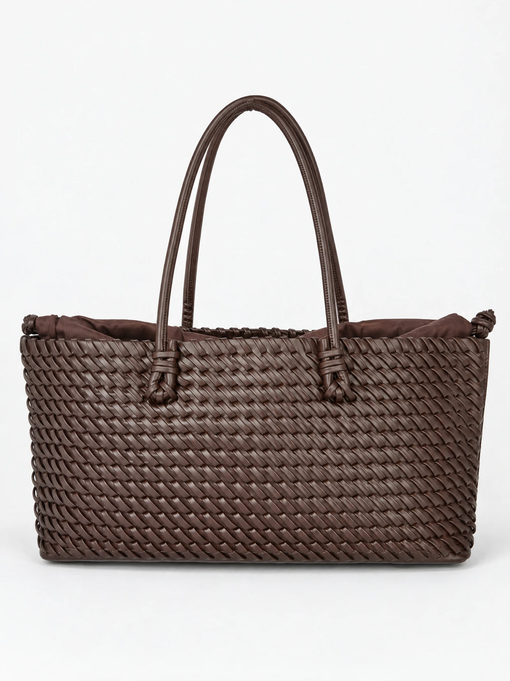 Brown woven shoulder bag with braided texture, knotted handles, and a gathered fabric lining in a front studio view.